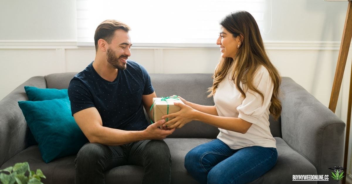man getting a gift from their female partner